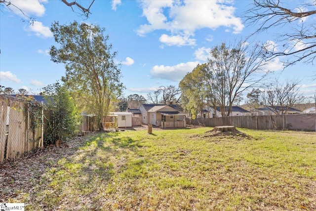 view of yard with a storage shed