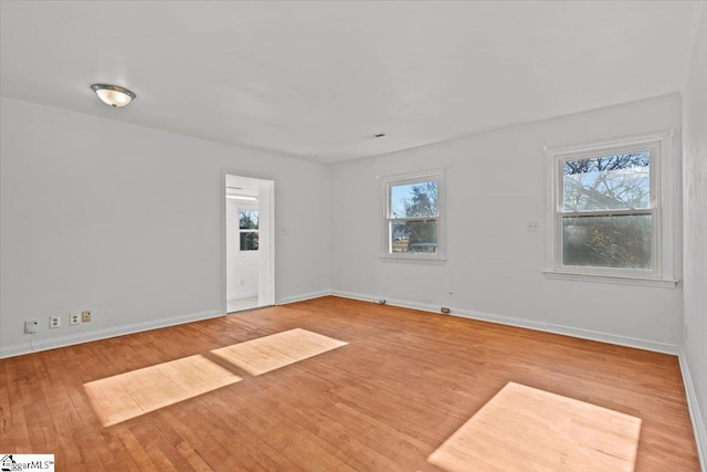 unfurnished room featuring light wood-type flooring