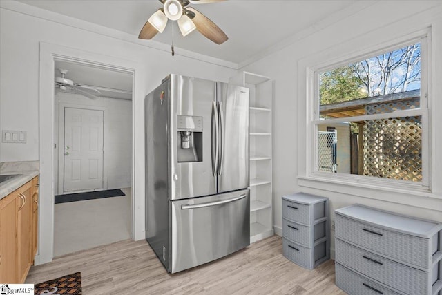 kitchen with stainless steel fridge with ice dispenser, light hardwood / wood-style floors, ceiling fan, and ornamental molding