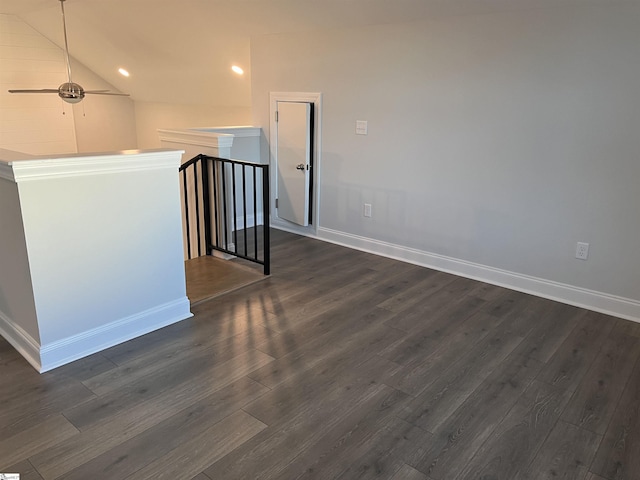 interior space with lofted ceiling, dark wood-type flooring, and ceiling fan