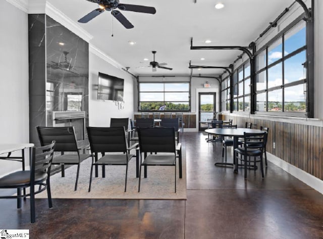 dining room featuring ceiling fan and crown molding