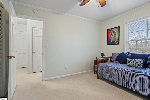 bedroom with ceiling fan, light carpet, and ornamental molding