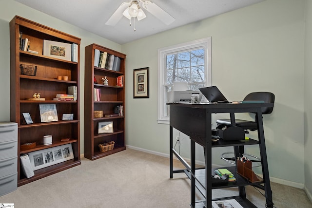 office featuring ceiling fan and light colored carpet