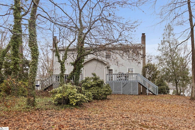 view of home's exterior featuring a wooden deck