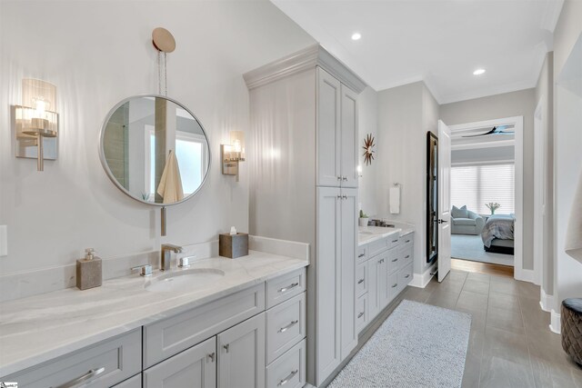 bathroom featuring ceiling fan and vanity