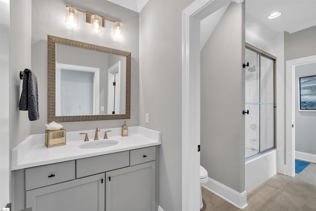 full bathroom featuring vanity, toilet, and enclosed tub / shower combo