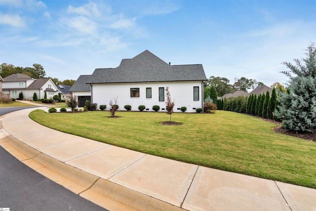 view of side of property featuring a yard