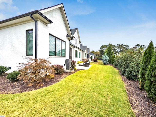 view of home's exterior featuring a yard