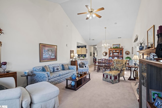 living room featuring high vaulted ceiling, light colored carpet, and ceiling fan with notable chandelier