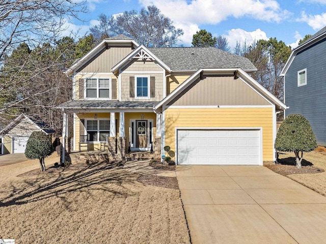 craftsman inspired home featuring covered porch and a garage