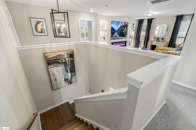 staircase featuring hardwood / wood-style floors