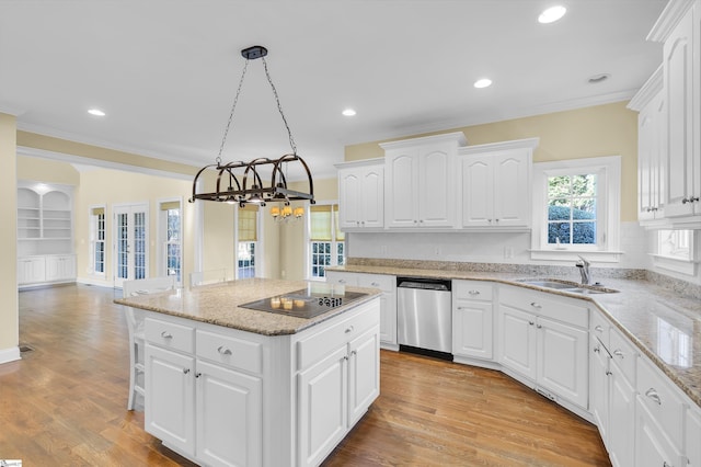 kitchen with dishwasher, black electric stovetop, sink, hanging light fixtures, and white cabinetry