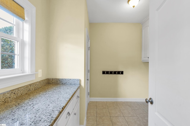 bathroom with tile patterned flooring and vanity