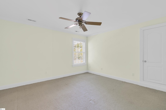 carpeted empty room with ceiling fan