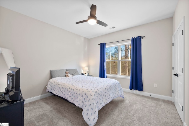 carpeted bedroom with ceiling fan