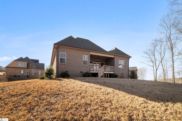 back of house with a lawn