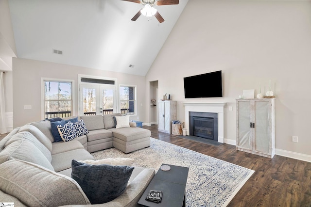 living room with ceiling fan, french doors, high vaulted ceiling, and dark wood-type flooring