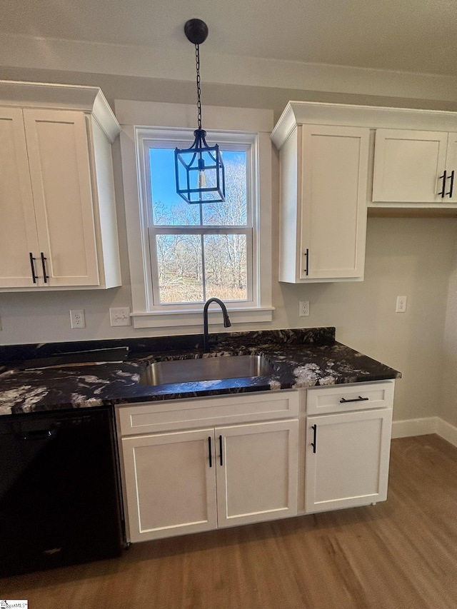 kitchen with sink, pendant lighting, dishwasher, dark hardwood / wood-style floors, and white cabinetry