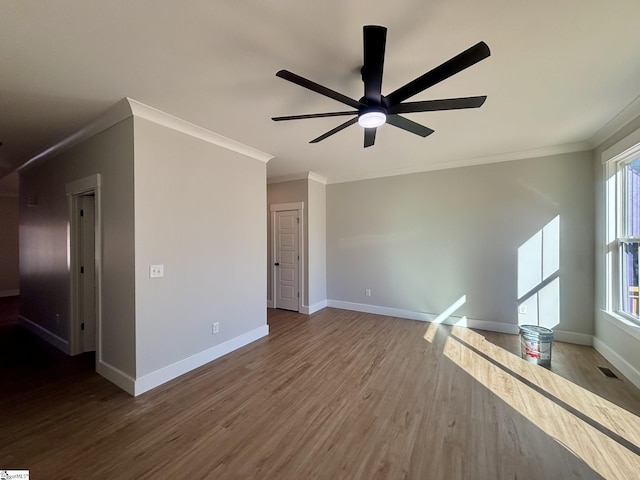 unfurnished living room with hardwood / wood-style flooring, ceiling fan, and ornamental molding