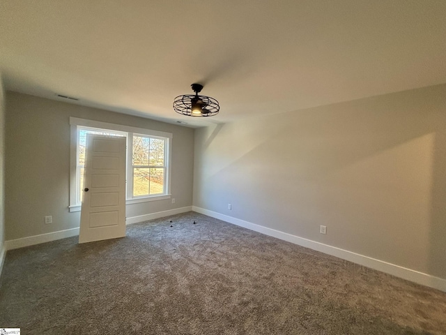 carpeted empty room with ceiling fan