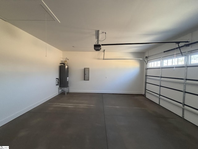 garage featuring gas water heater, a garage door opener, and electric panel