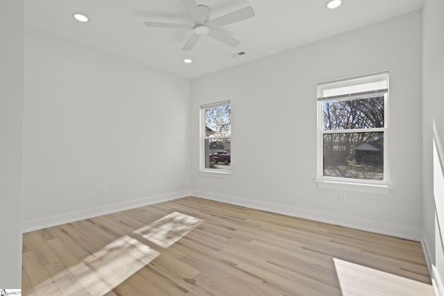 spare room featuring ceiling fan and light wood-type flooring