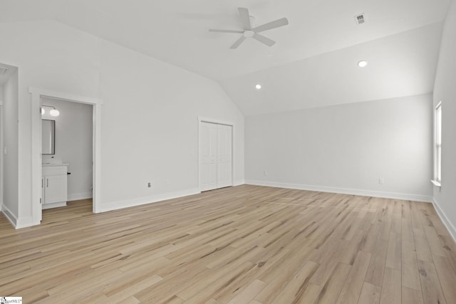 unfurnished room featuring ceiling fan, light hardwood / wood-style flooring, and lofted ceiling