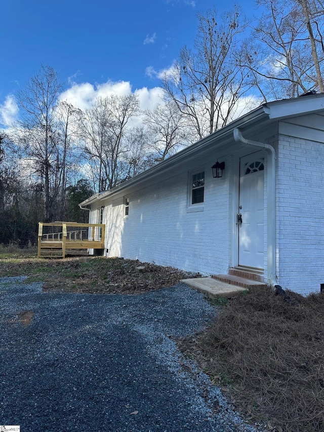 doorway to property with a wooden deck