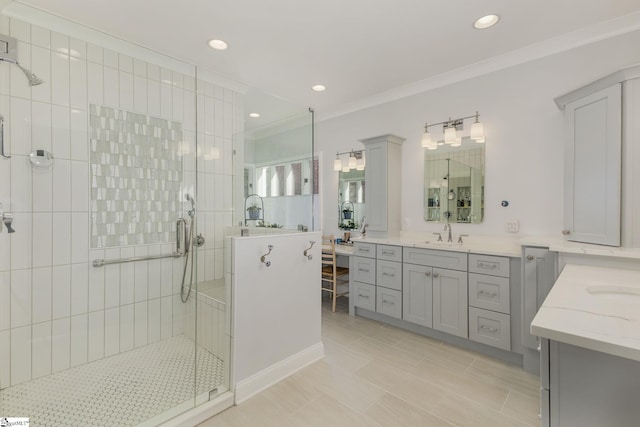 bathroom featuring tile patterned flooring, vanity, ornamental molding, and a shower with door