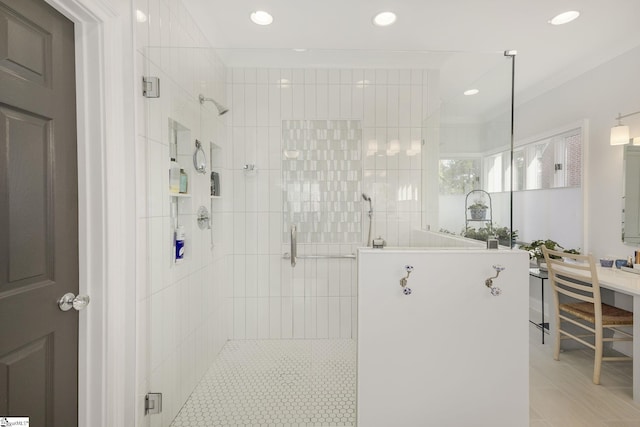 bathroom featuring crown molding and an enclosed shower