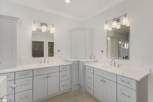 bathroom with vanity and crown molding