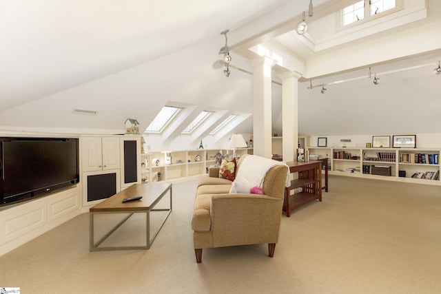 living room with a healthy amount of sunlight, light colored carpet, and high vaulted ceiling