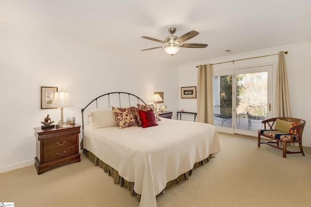 carpeted bedroom featuring ceiling fan, ornamental molding, and access to outside