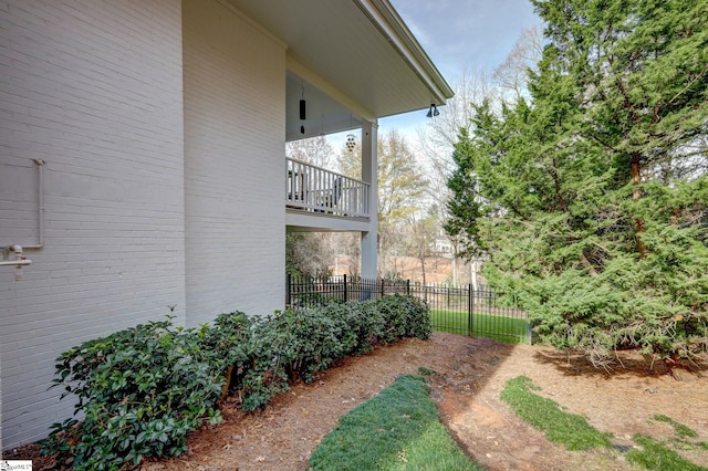 view of yard with a balcony