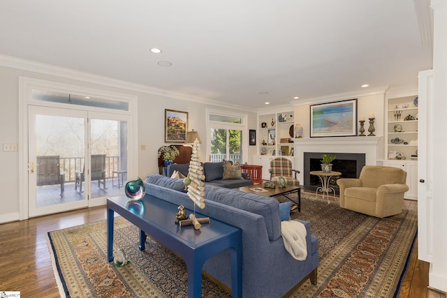 living room featuring dark hardwood / wood-style floors and crown molding