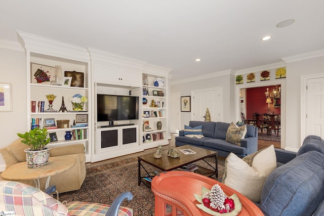 living room with built in features, a chandelier, and ornamental molding