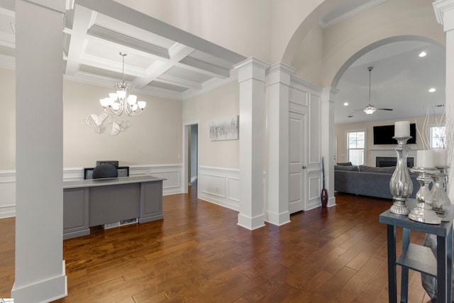 kitchen with coffered ceiling, ceiling fan with notable chandelier, ornamental molding, beamed ceiling, and decorative columns