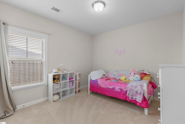 bedroom with light carpet