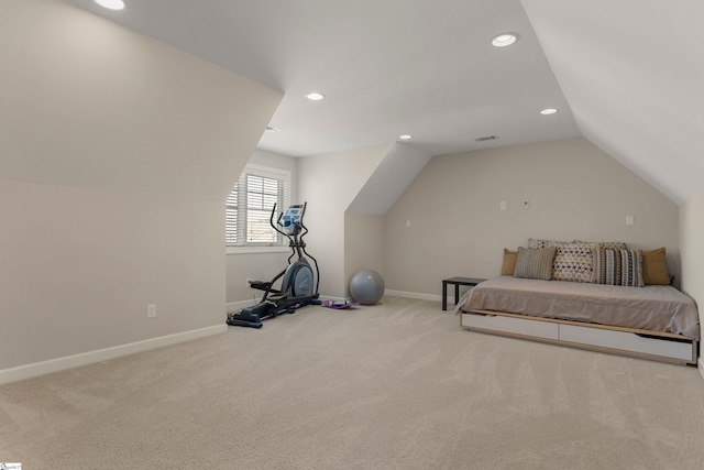 carpeted bedroom featuring vaulted ceiling