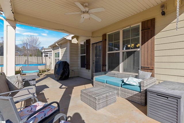 view of patio / terrace with ceiling fan, a trampoline, grilling area, and an outdoor hangout area