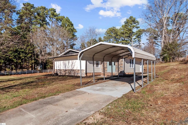 view of car parking with a lawn and a carport