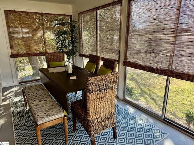 sunroom / solarium featuring a healthy amount of sunlight