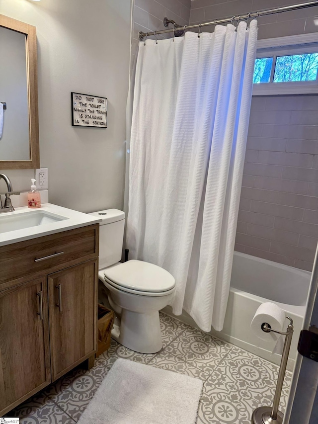 full bathroom with tile patterned floors, vanity, toilet, and shower / tub combo