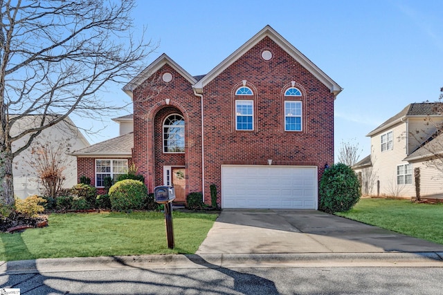 view of front facade with a front yard and a garage