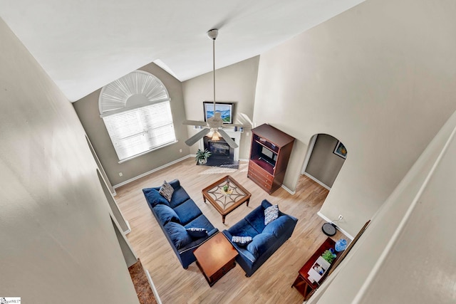 living room featuring hardwood / wood-style floors and vaulted ceiling