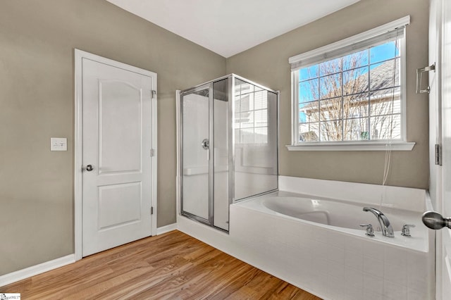 bathroom with separate shower and tub and hardwood / wood-style floors