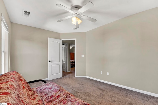 living area featuring light carpet and ceiling fan