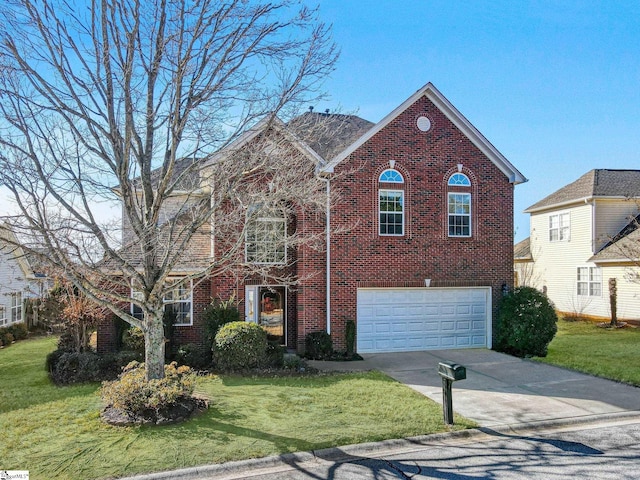 view of front of house with a front yard and a garage