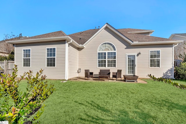 rear view of house with a yard, a patio, and an outdoor hangout area