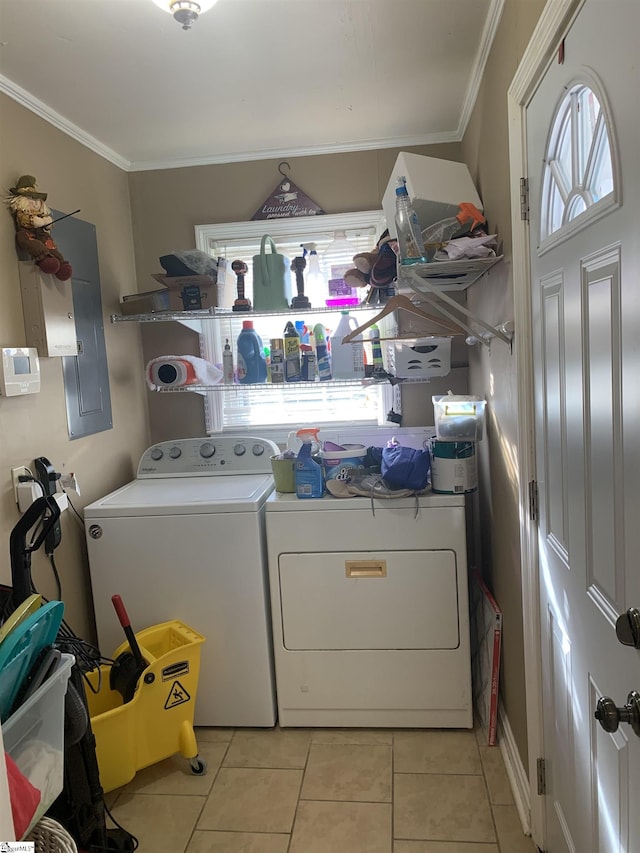 laundry area with electric panel, crown molding, light tile patterned flooring, and independent washer and dryer